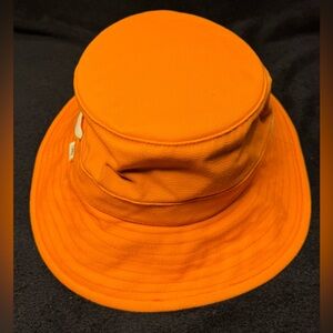 The Tilley bucket hat. Orange. Used in good condition.